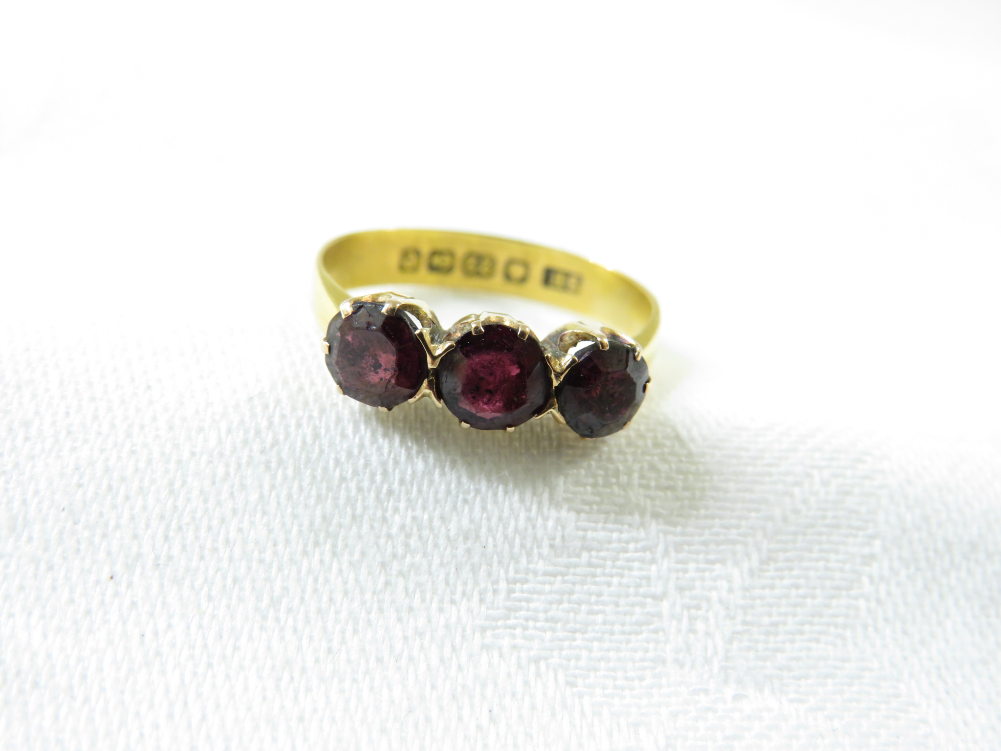 22ct gold ring set with three garnets, British assay marks, total weight of ring 3.2g, size P for - Image 2 of 2