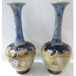 Pair of Royal Doulton bottle vases, pale blue glazed neck, the bodies with tubed line decoration