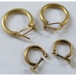 A pair of yellow metal hoop earrings with brushed finish, indistinct stamped marks, (together 5.3g);