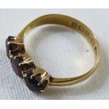 22ct gold ring set with three garnets, British assay marks, total weight of ring 3.2g, size P for