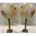 A pair of table lamps made from 1830s brass church candle sticks and fitted with 1930s vellum and