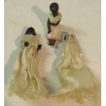 Three miniature china dolls - two are modelled standing with satin robes, height 4.5cm, the other