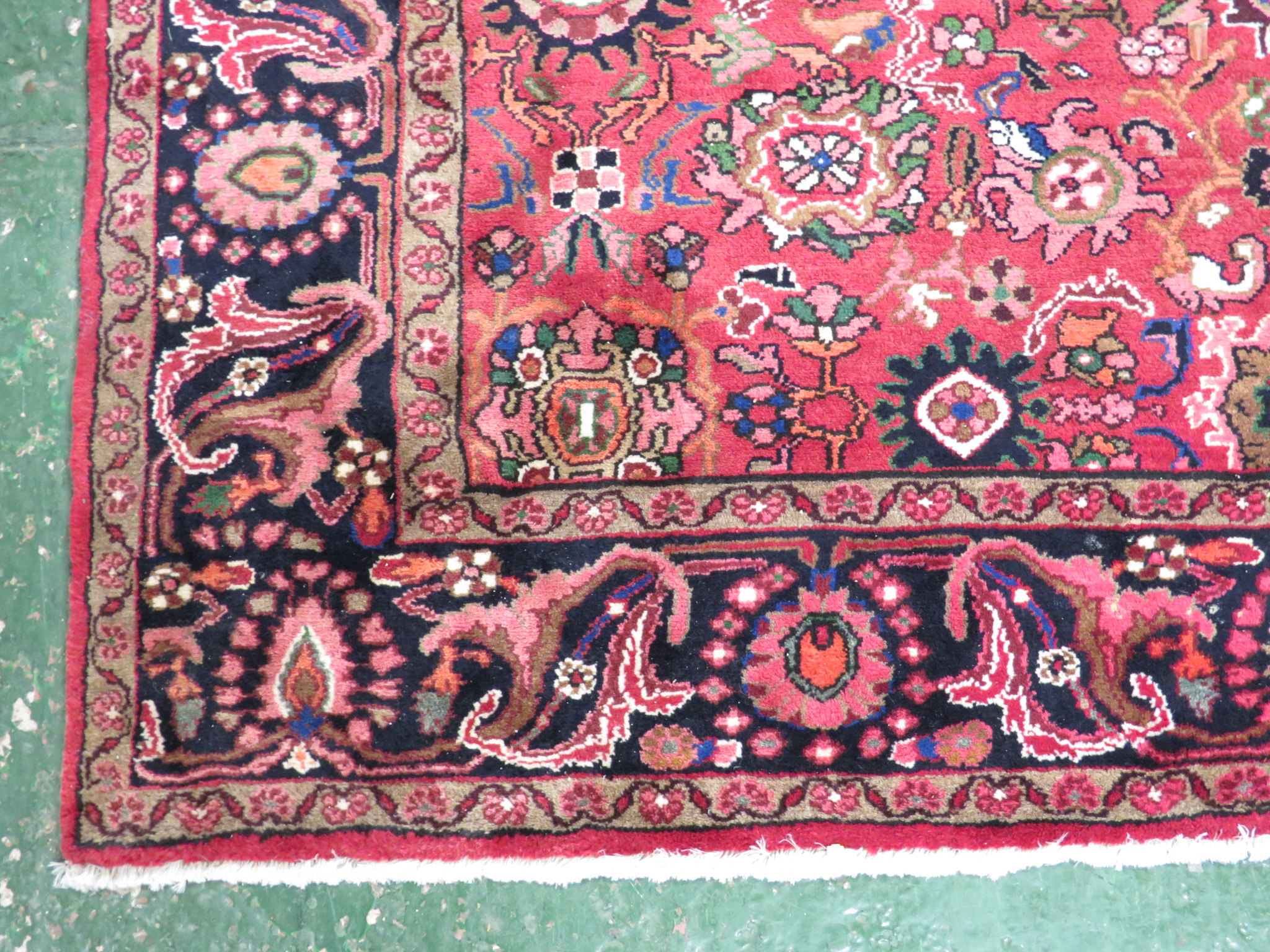 An Iranian carpet with three floral margins, a central reservation with single medallion and - Image 3 of 3