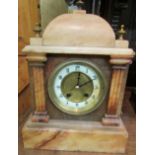 A Victorian marble striking mantle clock. The circular ceramic Arabic chapter is enclosed in a brass