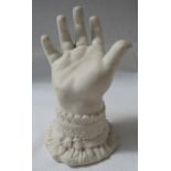 Parian porcelain ring stand modelled as a child's hand with lace cuff, diamond registration mark,