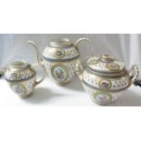 A continental porcelain three part tea set comprising teapot (lid absent), a lidded two-handled