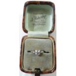 A solitaire diamond ring, the old mine cut stone estimated at 0.6 carat, the shank un-stamped and
