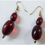 A pair of amber double bead earrings, each earring with a larger and smaller bead, drop about 3cm