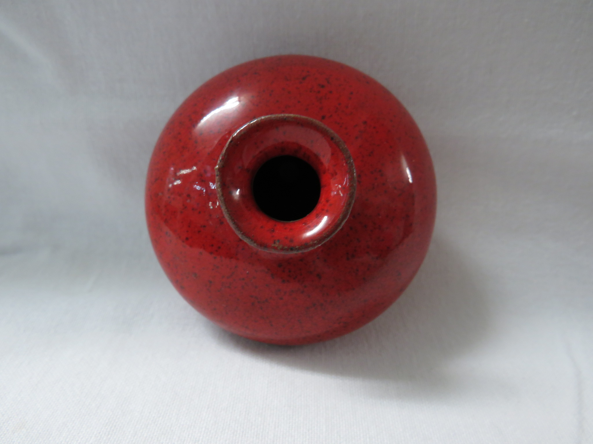 A Ming style terracotta vase or pot of squat form in a bright red mottled glaze falling short of the - Image 2 of 3