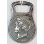 A bottle opener moulded with portrait head and marked CHARLES CHRISTOFLE ORFEVRE A PARIS 1805-