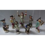 A hand painted porcelain Monkey Orchestra in the style of Meissen comprising a conductor and six