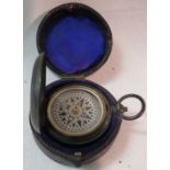 A magnetic pocket compass, the outer case marked TOVEY BATH, (diameter 4.5cm), in a velvet lined