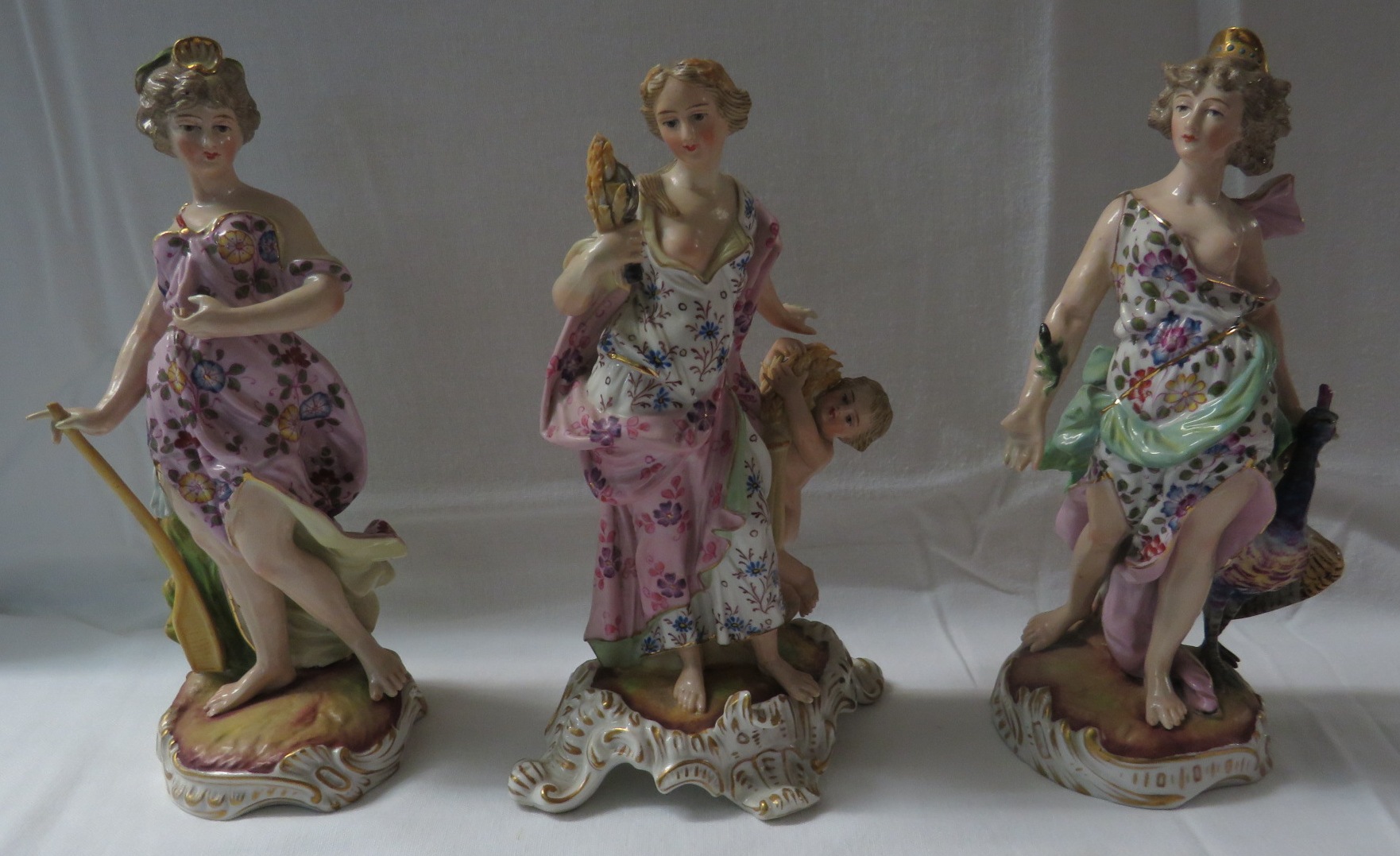 A matched group of three porcelain Classical and allegorical figures representing Juno, Ceres and