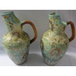 Pair of Doulton Lambeth Slater stoneware ewers, impressed factory marks and painted numbers and