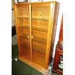 ERCOL LIGHT ELM GLAZED ILLUMINATED TWO DOOR CABINET WITH FOUR GLASS SHELVES