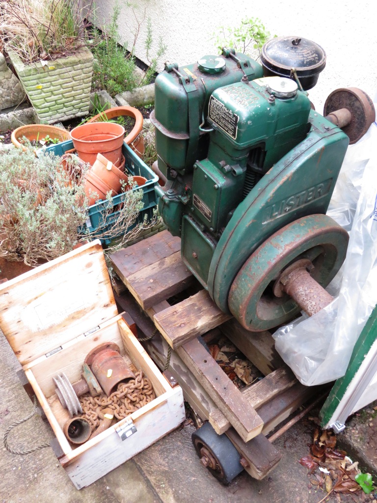 VINTAGE LISTER 2HP AIR COOLED STATIONARY DIESEL ENGINE ON WOODEN PLINTH AND WHEELED TROLLEY, GREEN