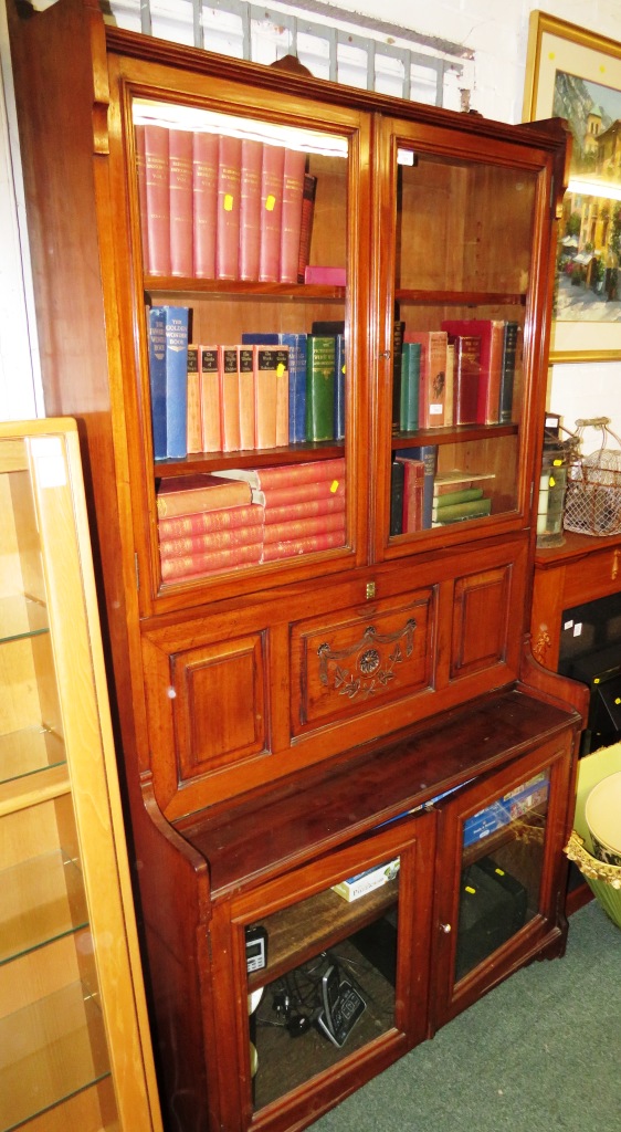 An early 20th century mahogany secretaire bookcase, the upper section with a two door glazed cabinet