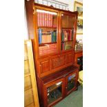 An early 20th century mahogany secretaire bookcase, the upper section with a two door glazed cabinet