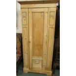 A stripped pine single door wardrobe with applied gesso mouldings height 191cm, width 90cm, depth