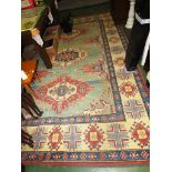 LARGE RED CREAM AND PALE GREEN GROUND PATTERNED FLOOR RUG WITH GEOMETRIC PATTERN