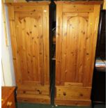 TWO SINGLE DOOR PINE WARDROBES, EACH WITH DRAWER TO BASE