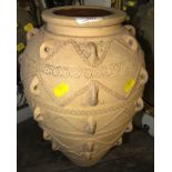 LARGE TERRACOTTA OVOID VASE WITH GLAZED INTERIOR AND RAISED DECORATION TO EXTERIOR