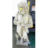 STONE GARDEN STATUE OF BOY IN COAT