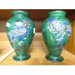 PAIR OF C H BRANNAM BARUM POTTERY VASES, GREEN GROUND DECORATED WITH OWLS, HEIGHT 20CM (A/F)