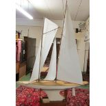 A large radio controlled two-masted pond yacht, length 187cm, height of main mast 210cm, overall