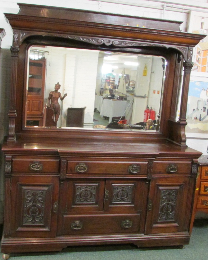 A late 19th / early 20th century large breakfront sideboard, the back panel with a single plain