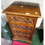 HARDWOOD FOUR DRAWER CHEST WITH CARVED DRAWER FRONTS AND METAL HANDLES