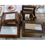 A collection of unmounted wooden frames together with mixed media studies of landscape and floral