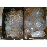 A large collection of mixed glassware to include decanters, vases, salad bowls,