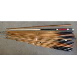 A variety of 17 pool and snooker cues,