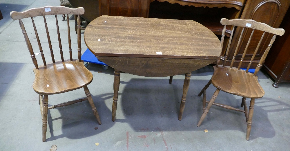 Drop leaf table with 2 matching spindle back chairs.