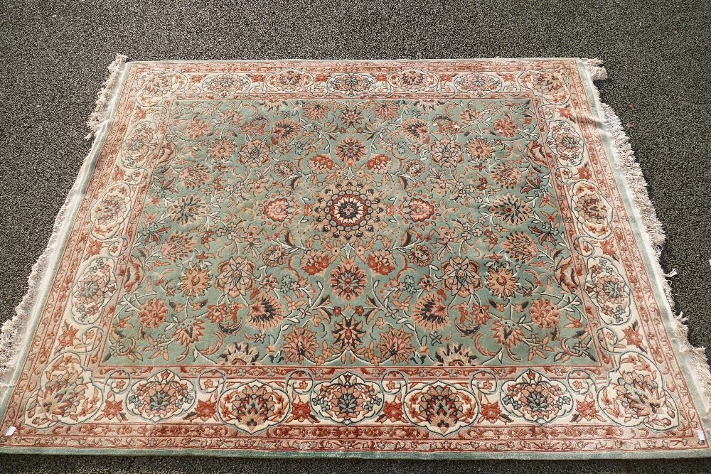 Large florally decorated blue, cream and brow rug 3.2m x 2.