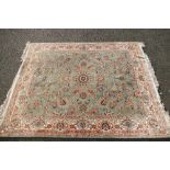 Large florally decorated blue, cream and brow rug 3.2m x 2.