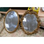 2 oval gold painted carved mirrors (2)