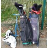 A large collection of golfing equipment to include 2 golf bags, various golf clubs; Callaway, Ping,