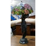 Resin figure of women with Tiffany style lamp shade