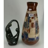 Large Abstract glazed terracotta vase together with similar stone figure children playing.