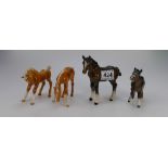 A collection of Beswick foals to include Palomino foal 946, Shetland foal 1034,