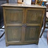 Oak linen fold drinks cabinet