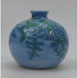 Lise Moorcroft small cast vase with Wisteria with a blue haze glaze. From 2008. 10cm high.