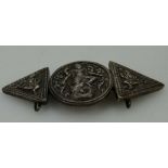 Silver Asian ornate belt buckle with budha with four arms being swallowed by fish