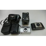 A collection of vintage cameras including Canon canonet 19, Paxina, Kodak,