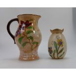 Royal Doulton Jug decorated in the Magnella design and another smaller jug in the Pansy design,