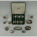 A collection of silver items to include various silver topped scent bottles, cruet set,