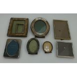 A collection of silver photo frames in various sizes and 4 silver plated and brass frames (8)