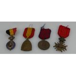 A collection of Belgium war medals comprising volunteers medal 1940-1945, WW1 cross,